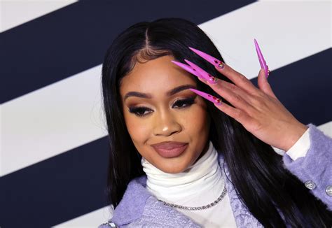 Saweetie sets pulses racing as she poses topless beneath a black blazer in jaw-dropping snap | Daily Mail Online Published: 03:37 EDT, 26 January 2021 | Updated: 15:59 EDT, 26 January 2021...